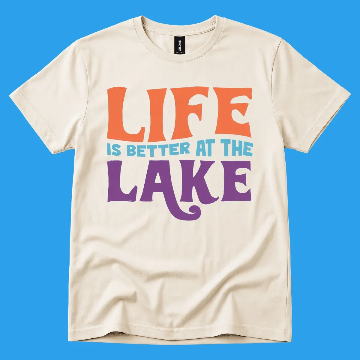 Retro typography design stating "LIFE IS BETTER AT THE LAKE" in orange, teal, and purple.
