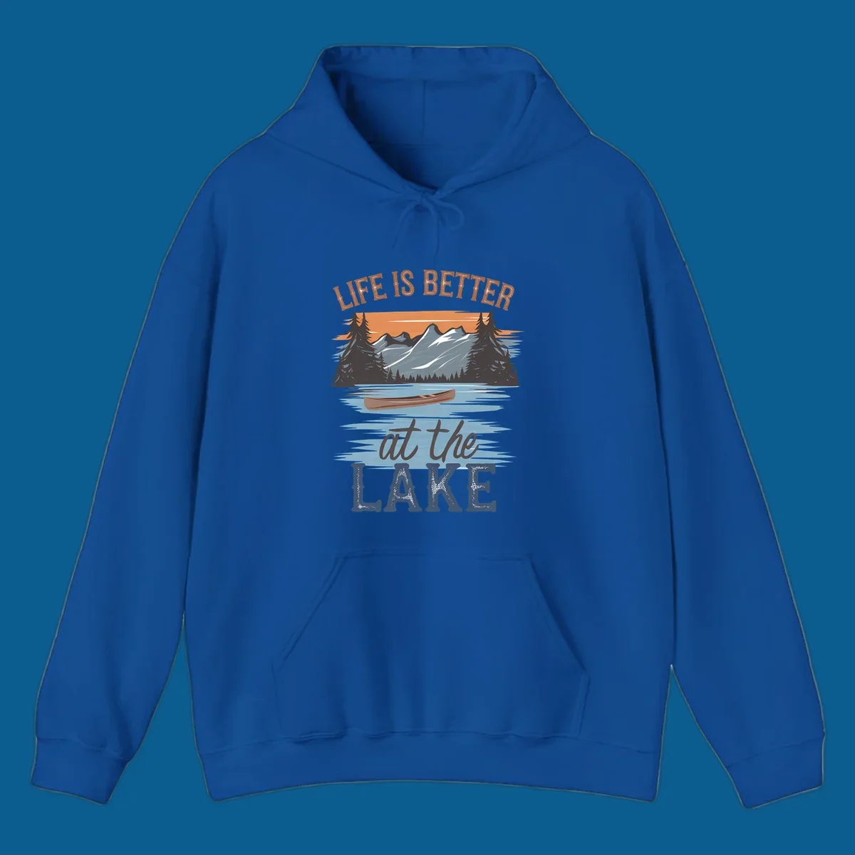 Life is better at the lake scenic design with mountains, canoe, and text.