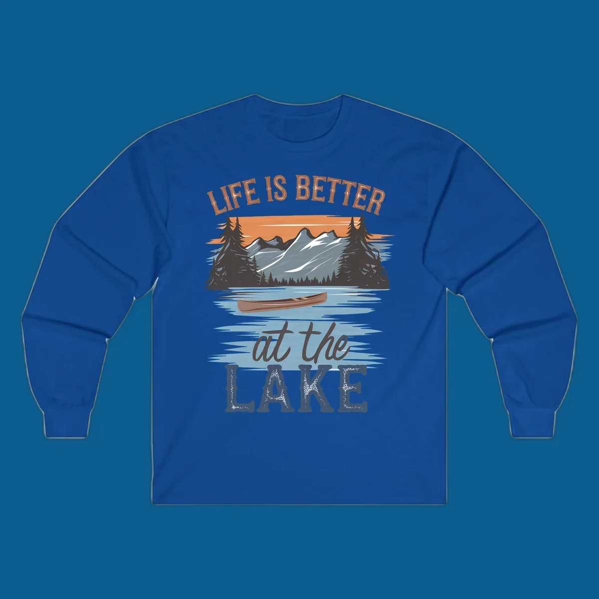Life is better at the lake scenic design with mountains, canoe, and text.