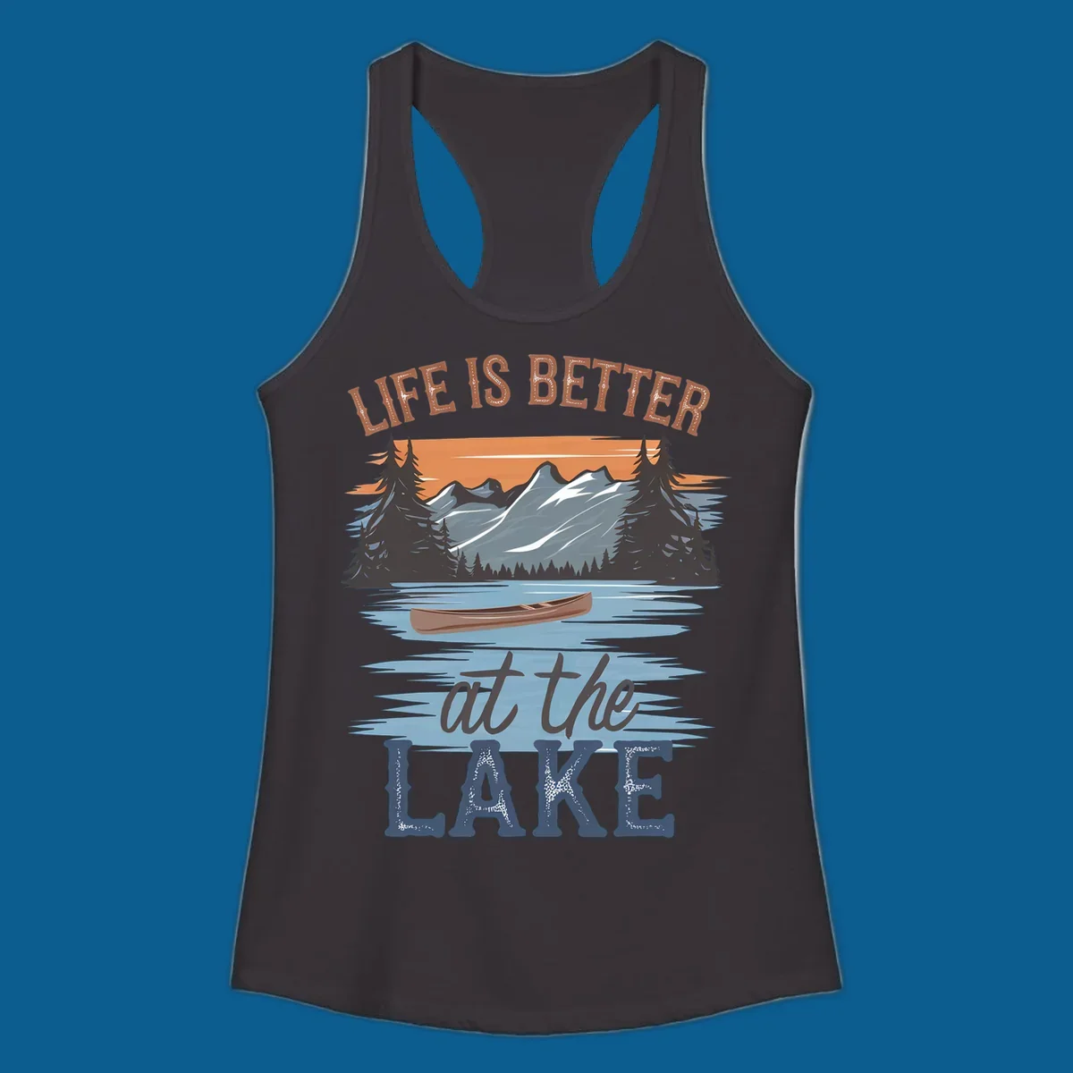 Life is better at the lake scenic design with mountains, canoe, and text.