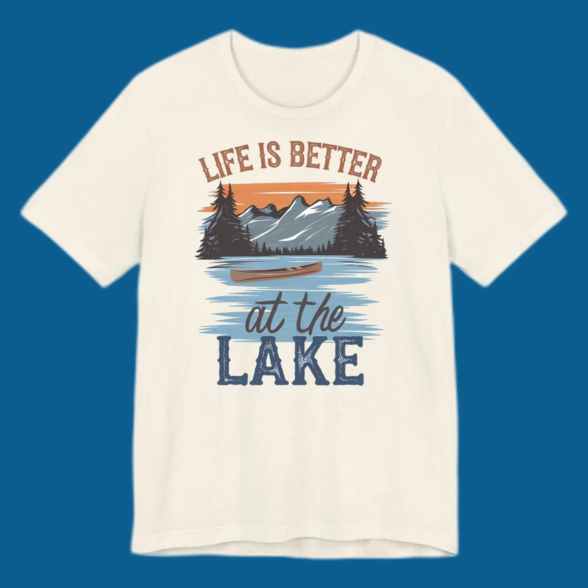 Life is better at the lake scenic design with mountains, canoe, and text.
