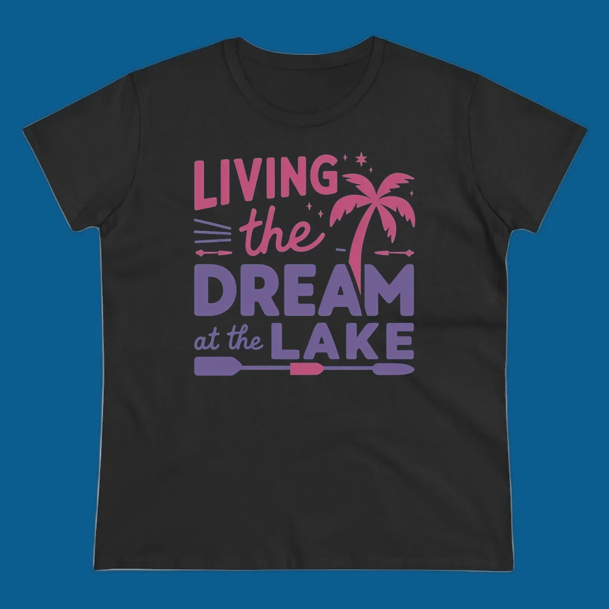 Living the dream at the lake text with palm tree and oars graphic