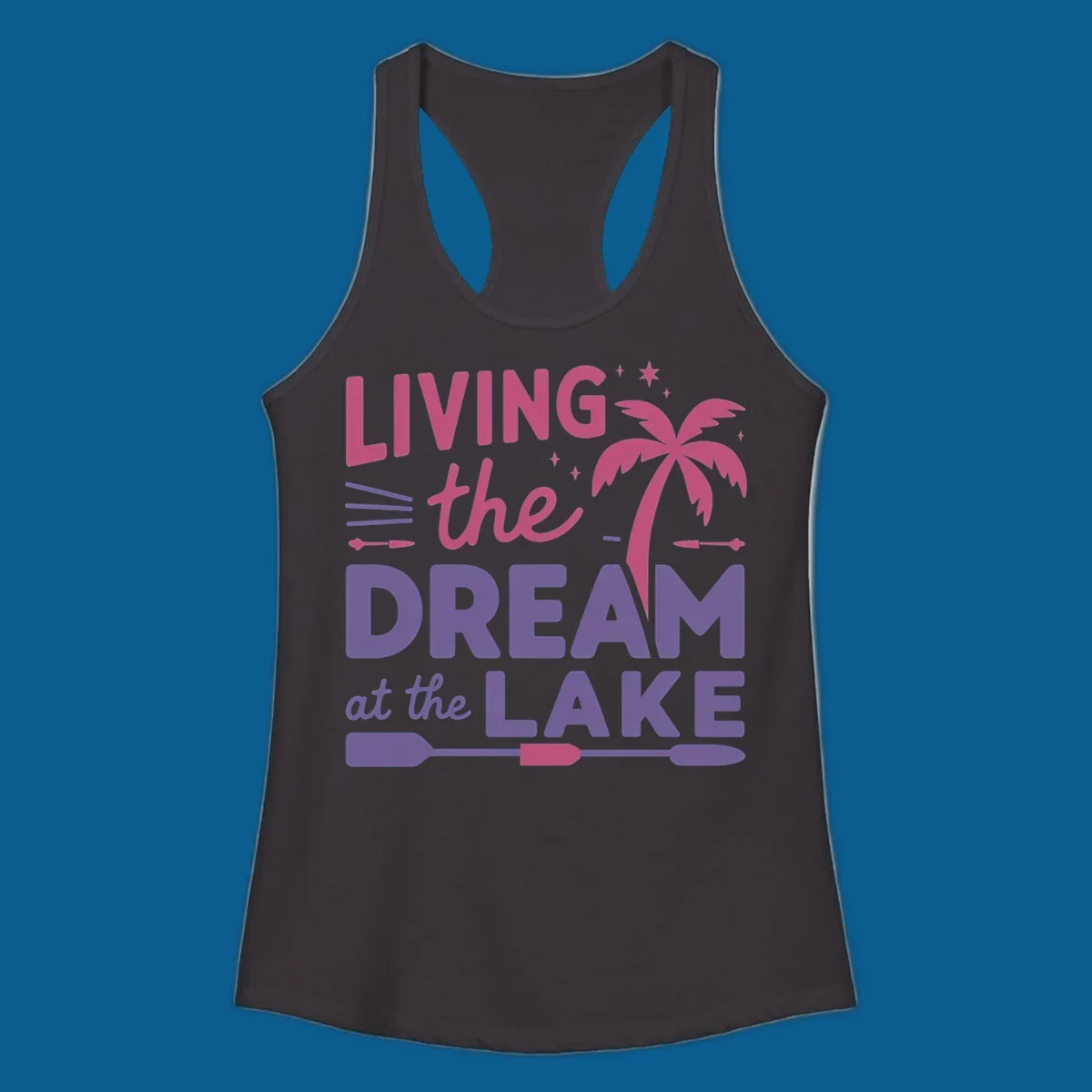 Living the dream at the lake text with palm tree and oars graphic