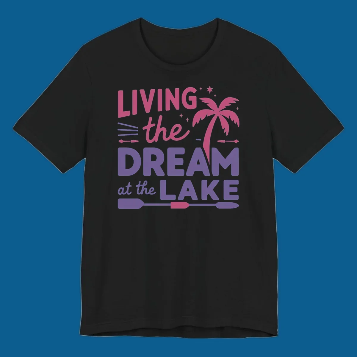 Living the dream at the lake text with palm tree and oars graphic