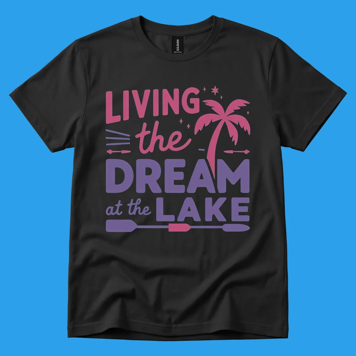 Living the dream at the lake text with palm tree and oars graphic