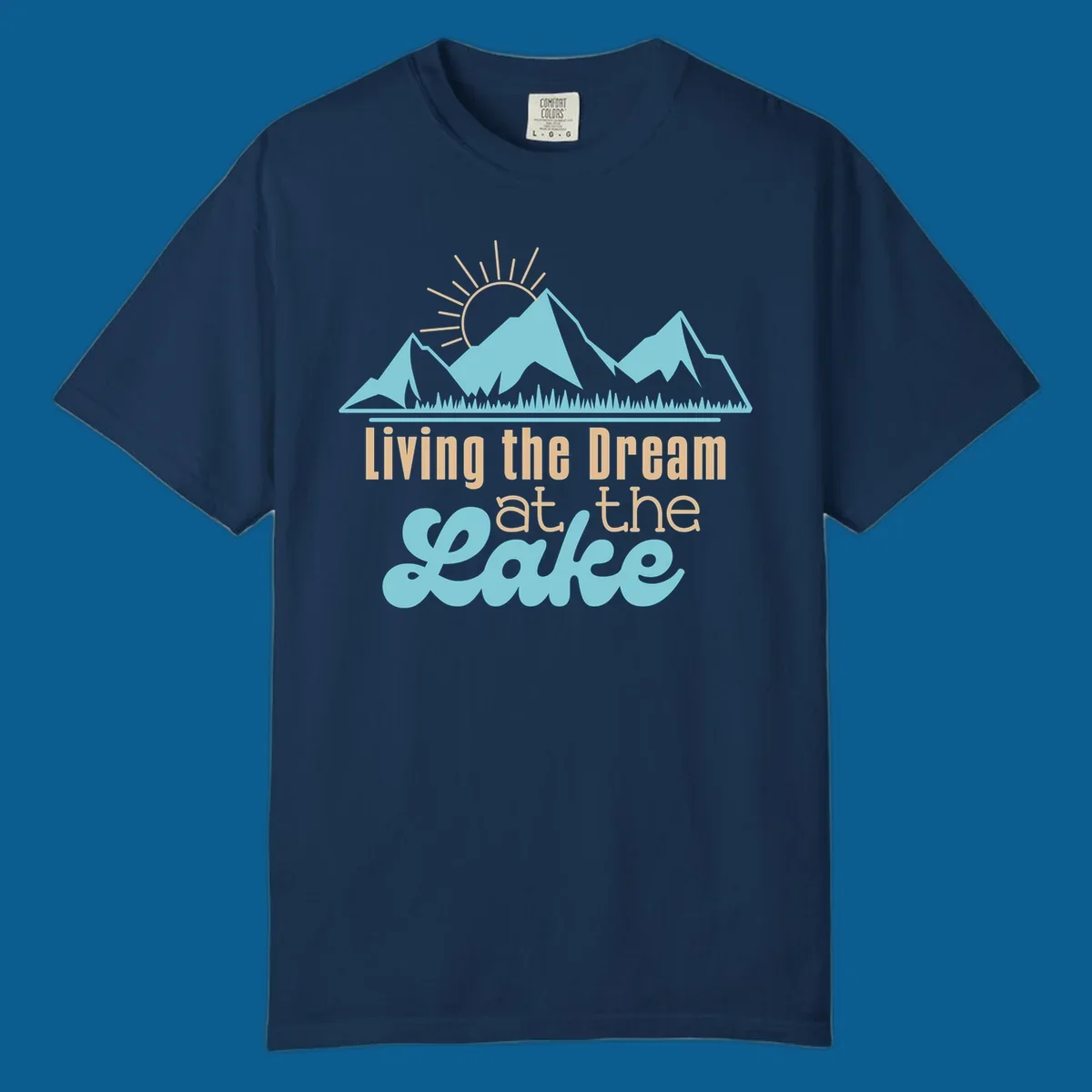 Scenic mountain range with sun and text 'Living the Dream at the Lake'.