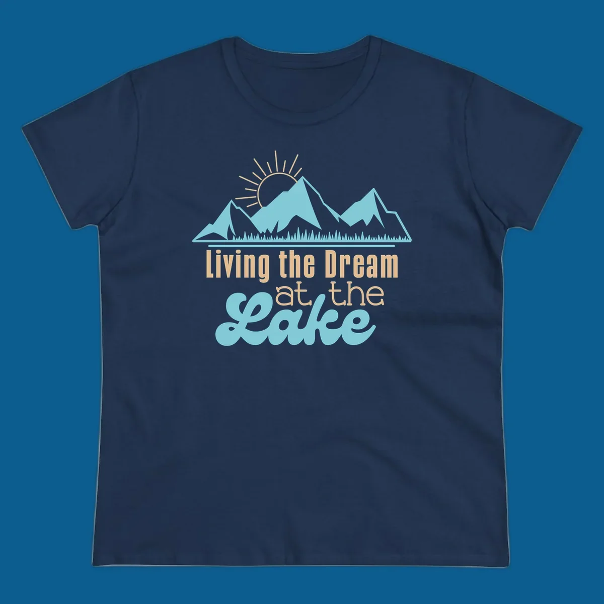 Scenic mountain range with sun and text 'Living the Dream at the Lake'.