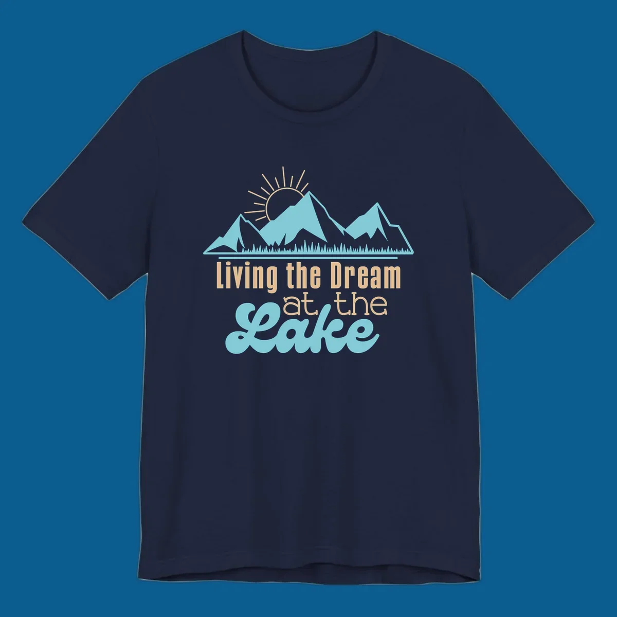 Scenic mountain range with sun and text 'Living the Dream at the Lake'.