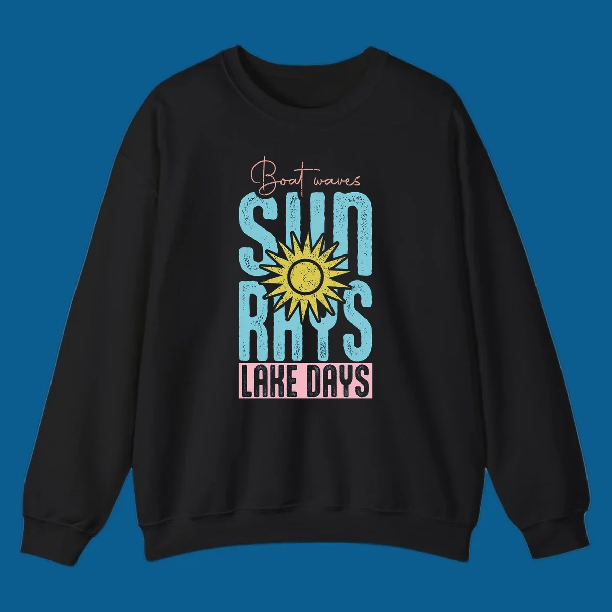 Boat waves sun rays lake days text design with a distressed sun illustration.