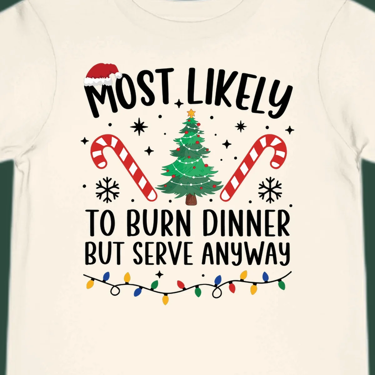 Most likely to burn dinner but serve anyway funny Christmas text with Santa hat, Christmas tree, and candy canes.