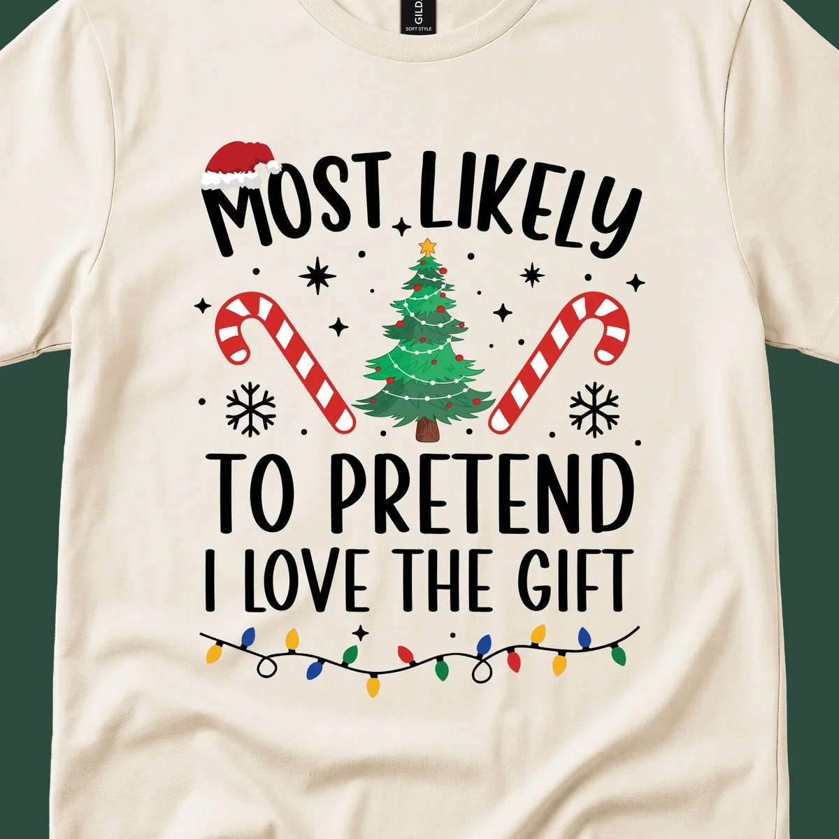 Most Likely To Pretend I Love Gift typography with Christmas elements.