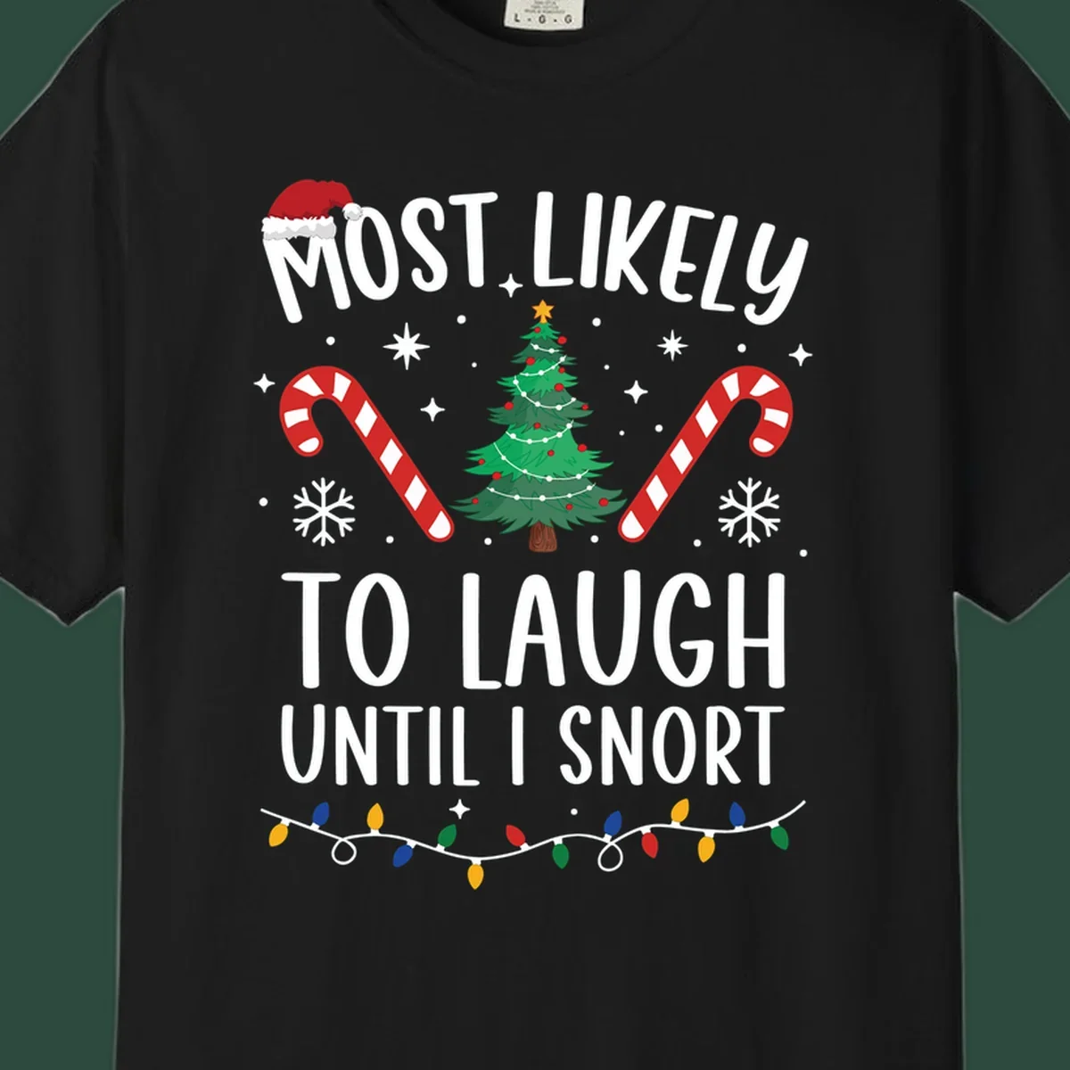 Most Likely To Laugh Until I Snort Christmas design with festive graphics.