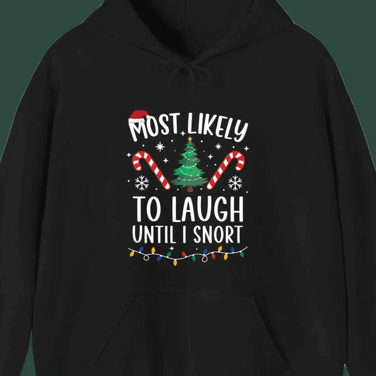 Most Likely To Laugh Until I Snort Christmas design with festive graphics.