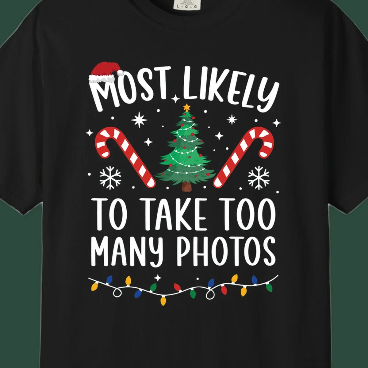 Most Likely To Take Too Many Photos Christmas design with text, candy canes, Christmas tree, and Santa hat.