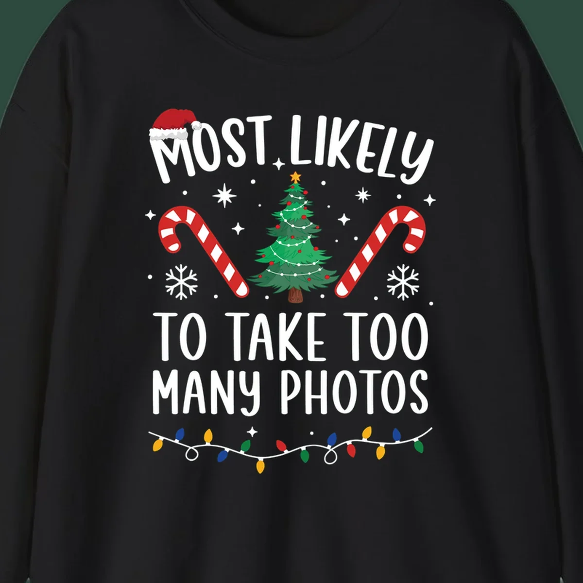 Most Likely To Take Too Many Photos Christmas design with text, candy canes, Christmas tree, and Santa hat.