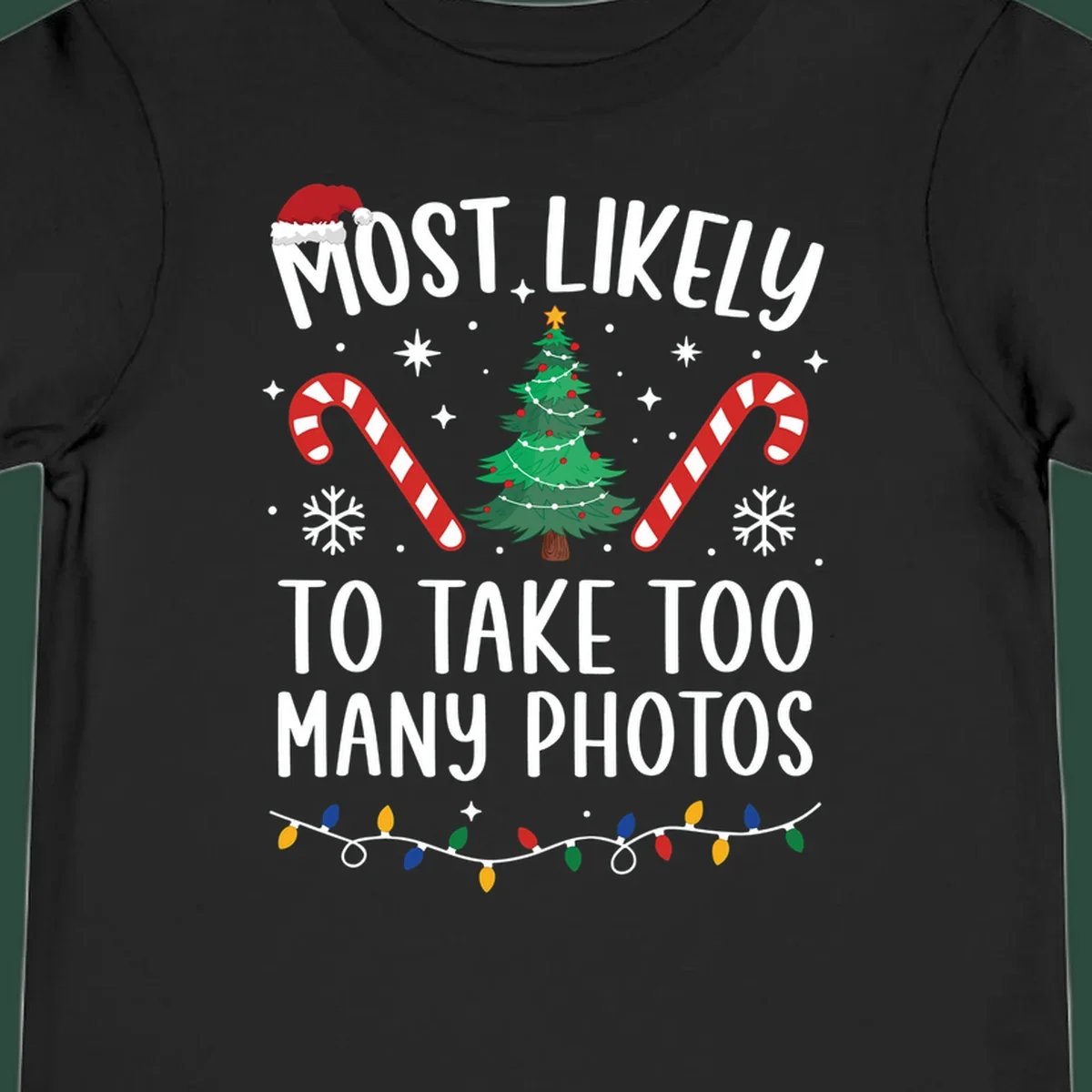 Most Likely To Take Too Many Photos Christmas design with text, candy canes, Christmas tree, and Santa hat.