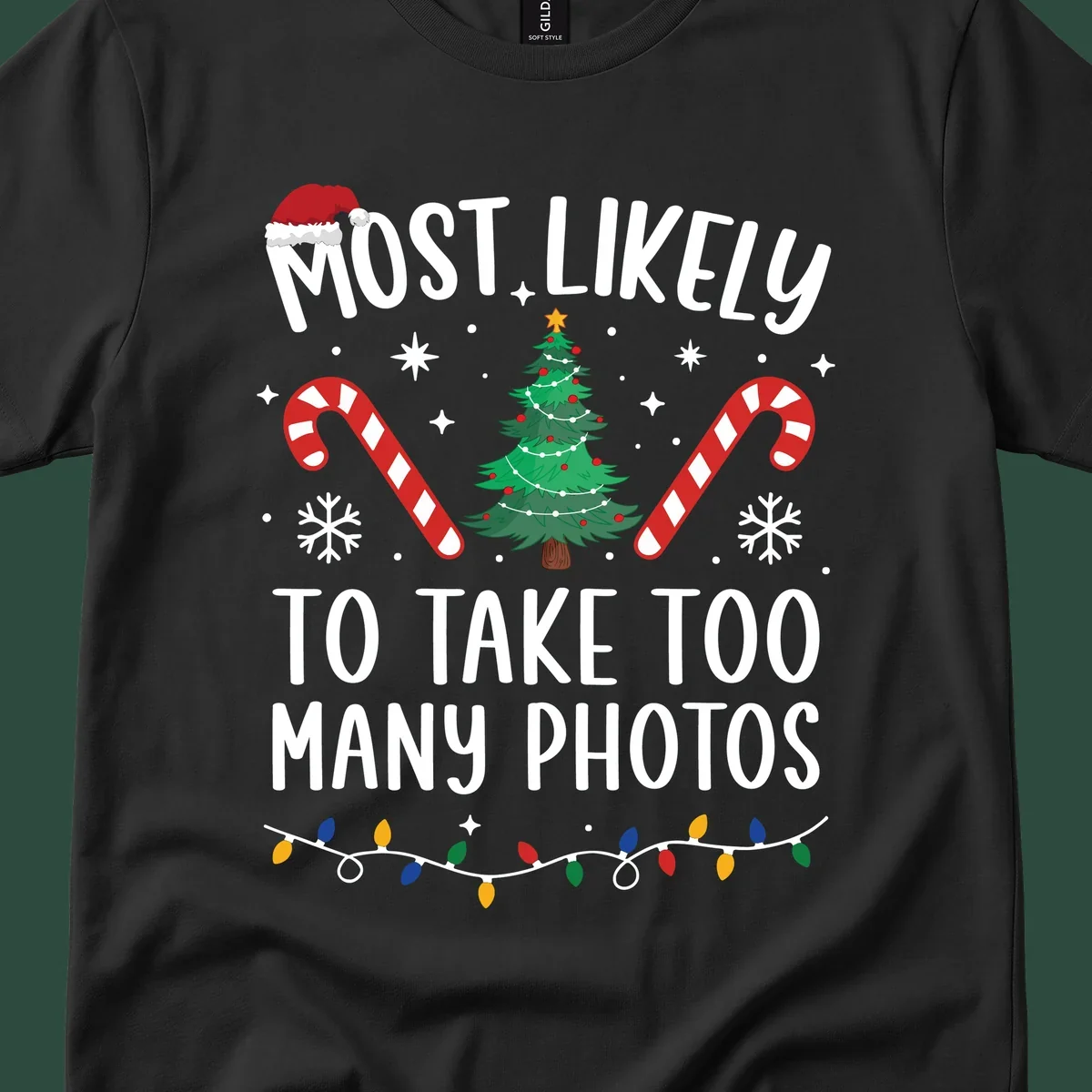 Most Likely To Take Too Many Photos Christmas design with text, candy canes, Christmas tree, and Santa hat.