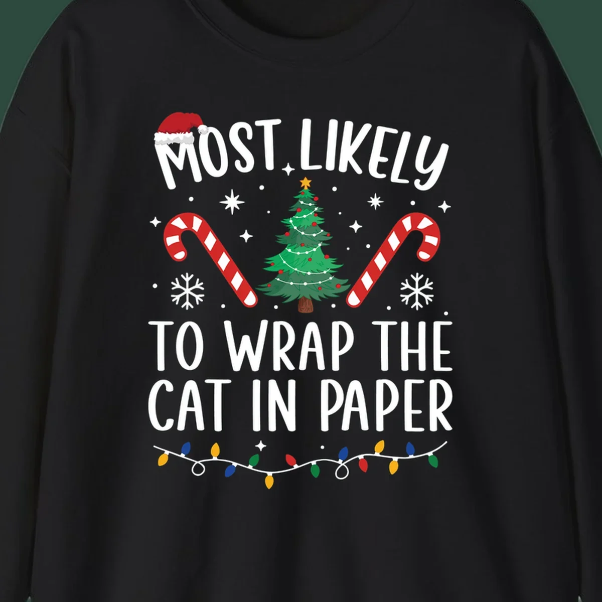 Most Likely To Wrap The Cat Christmas design with text, Santa hat, tree, candy canes, and lights.