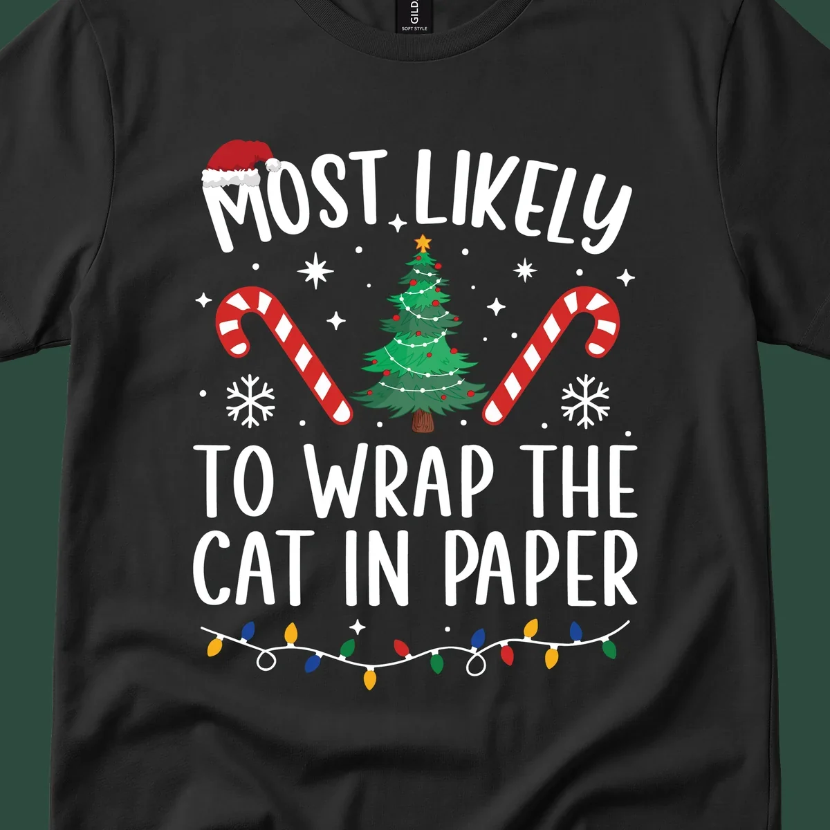 Most Likely To Wrap The Cat Christmas design with text, Santa hat, tree, candy canes, and lights.