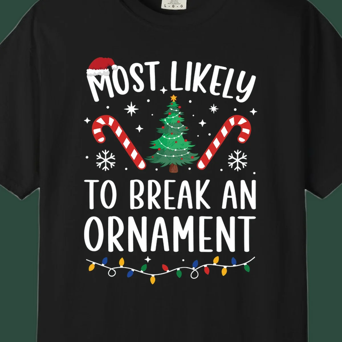 Most likely to break ornament Christmas graphic with text, tree, candy canes, and Santa hat.