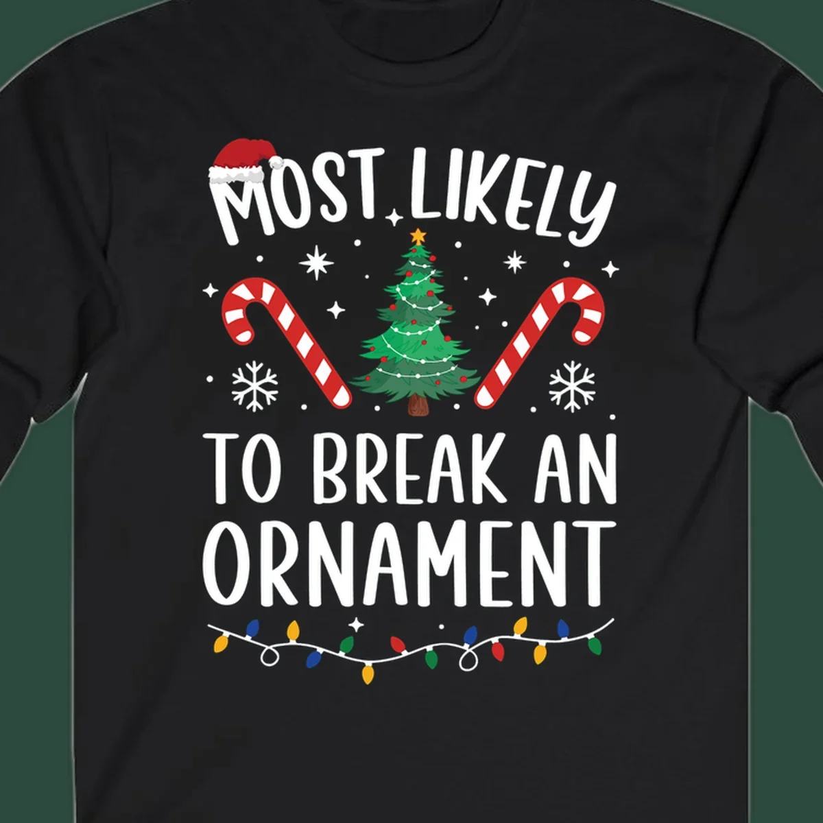 Most likely to break ornament Christmas graphic with text, tree, candy canes, and Santa hat.