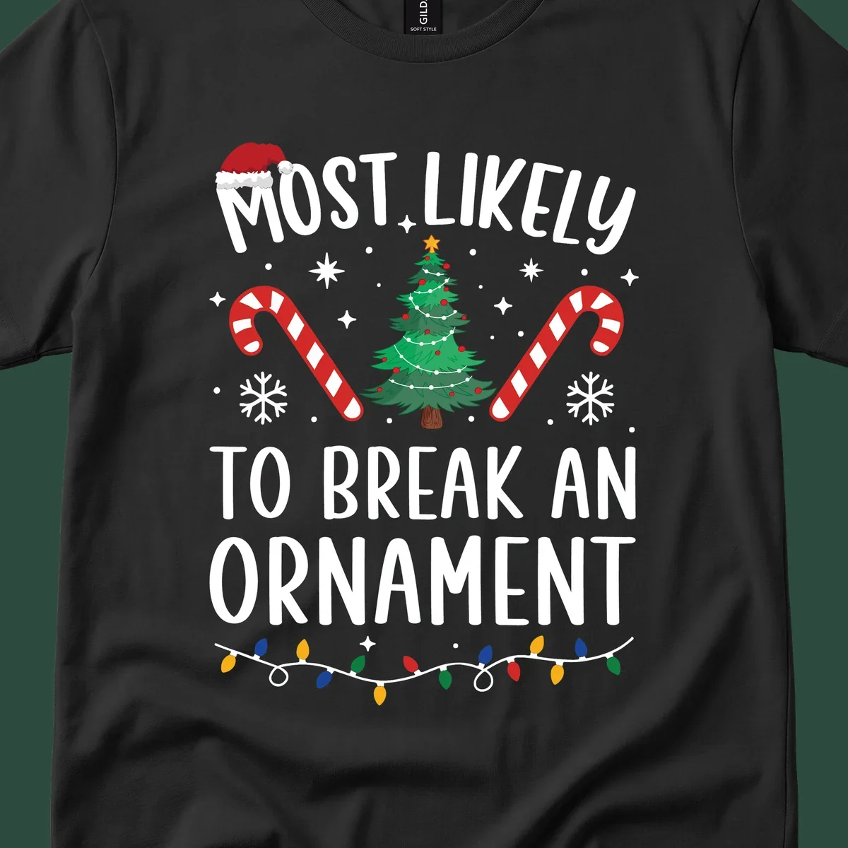 Most likely to break ornament Christmas graphic with text, tree, candy canes, and Santa hat.