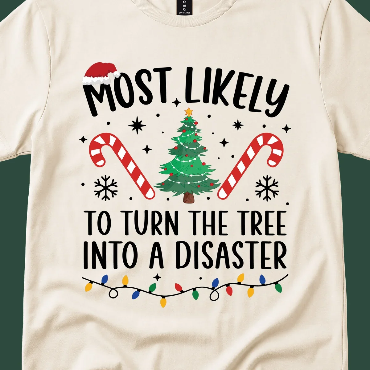Most Likely To Turn Tree Into Disaster Christmas design with Santa hat, tree, candy canes, and lights.