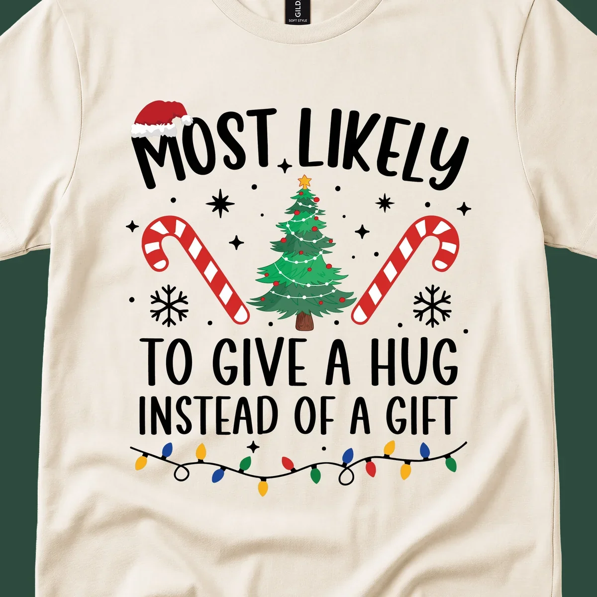 Most Likely To Give A Hug Christmas Design with text, tree, candy canes, and lights.