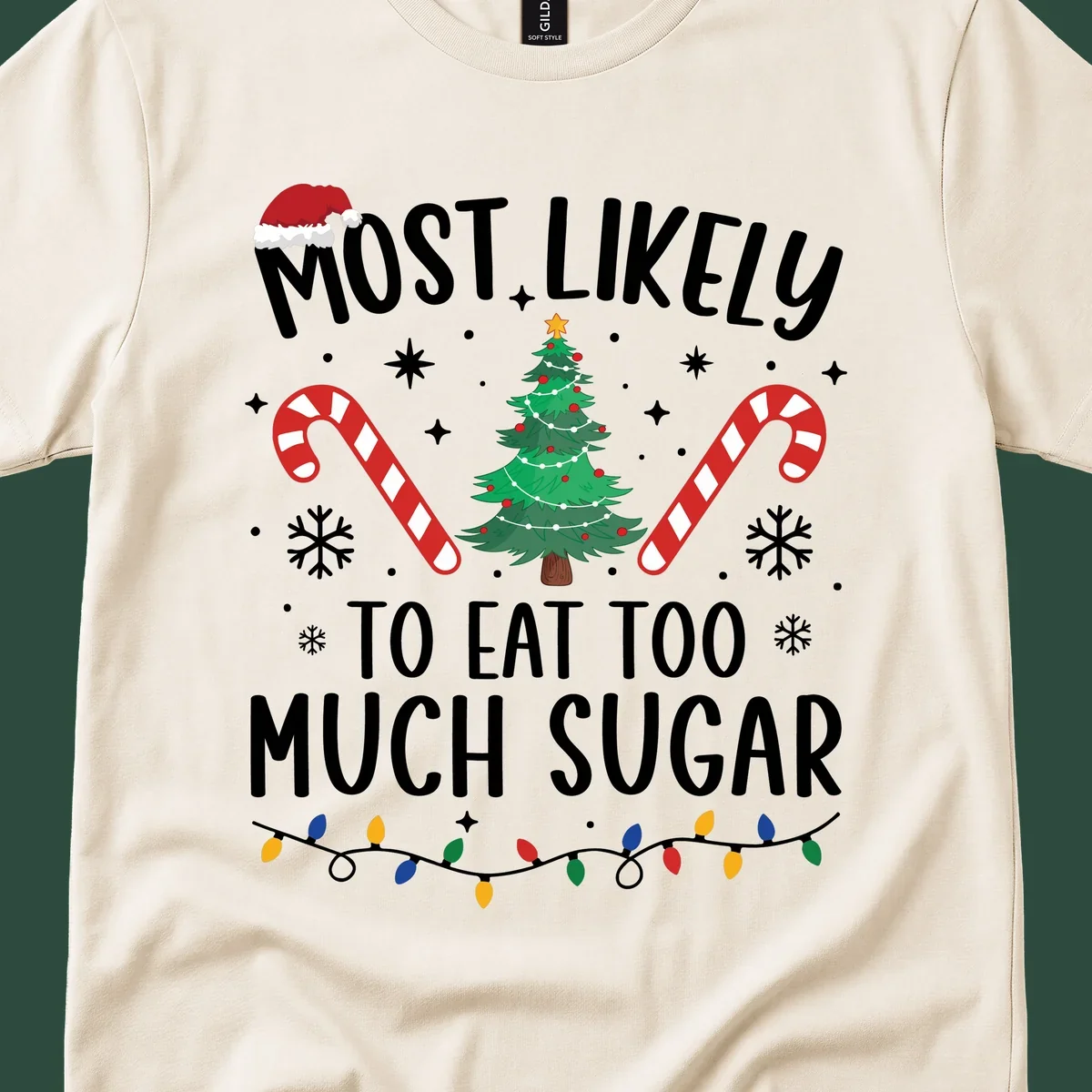 Most Likely To Eat Too Much Sugar Christmas design with text, tree, candy canes, and santa hat.