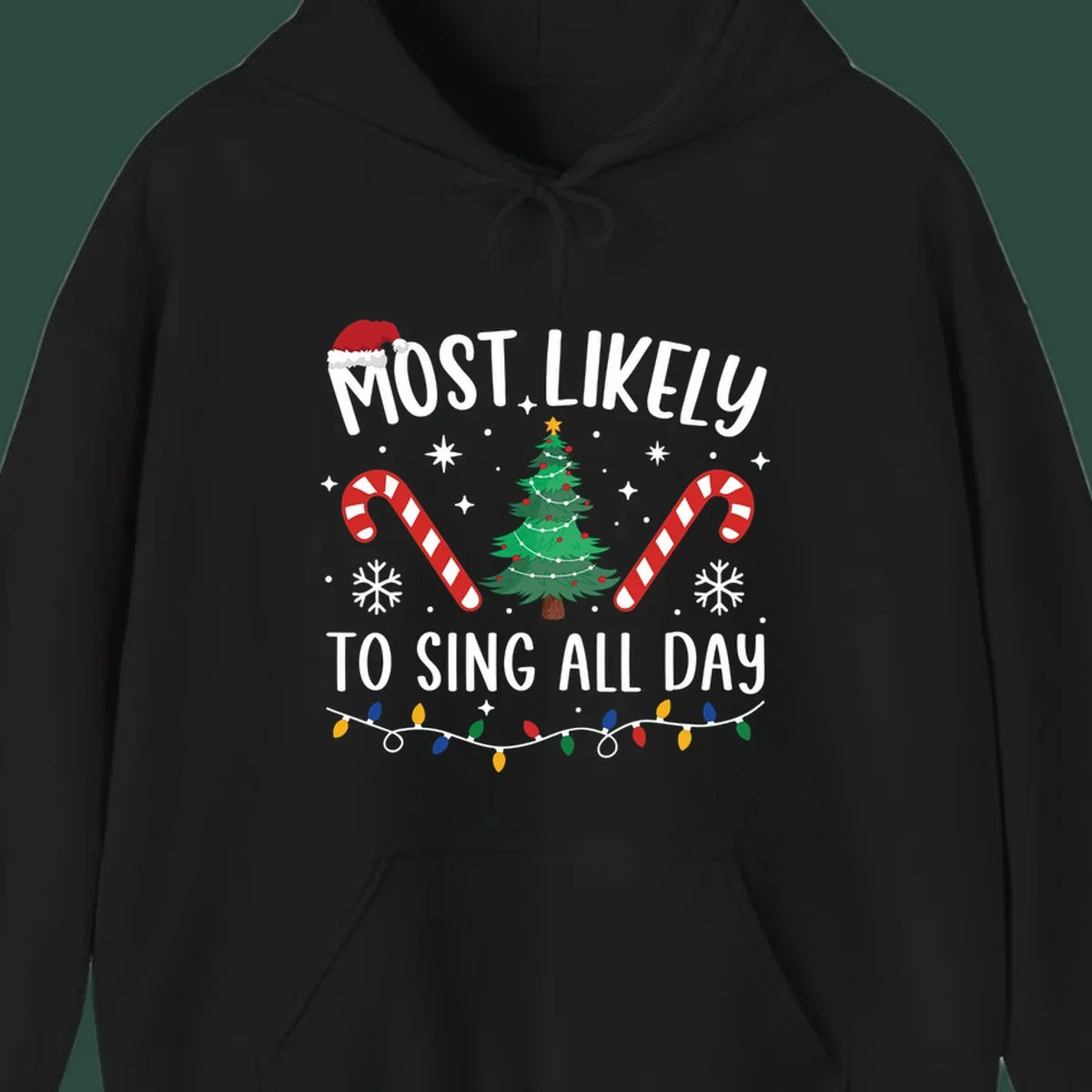 Most Likely To Sing All Day Christmas text with festive holiday graphics like a tree, candy canes, and lights.