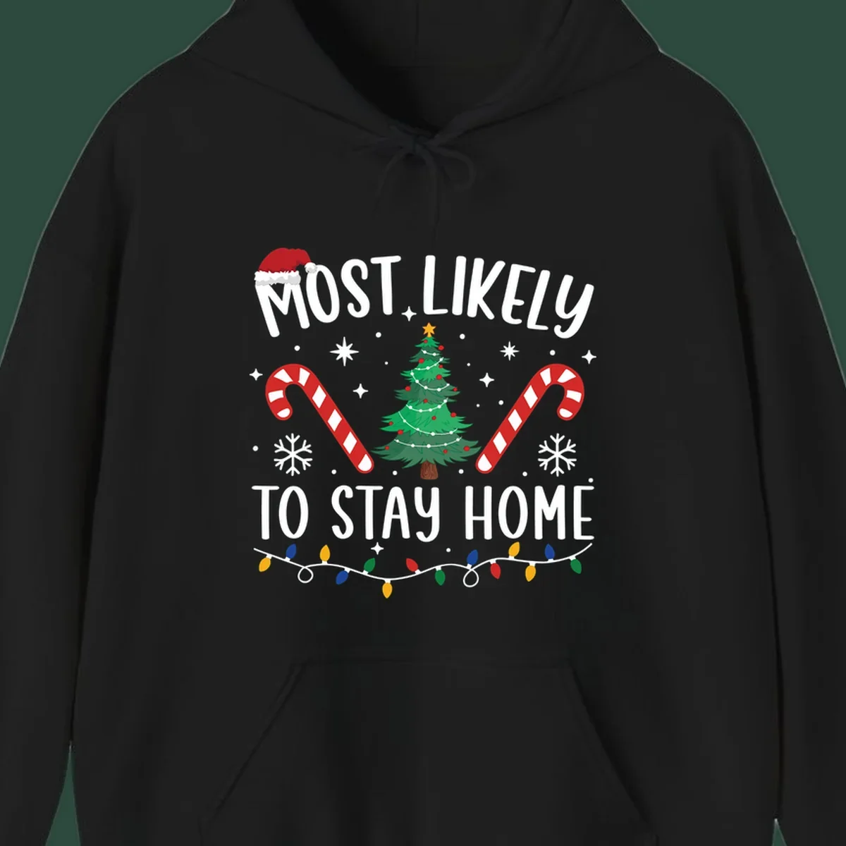 Most likely to stay home Christmas design with text, tree, candy canes, and lights.