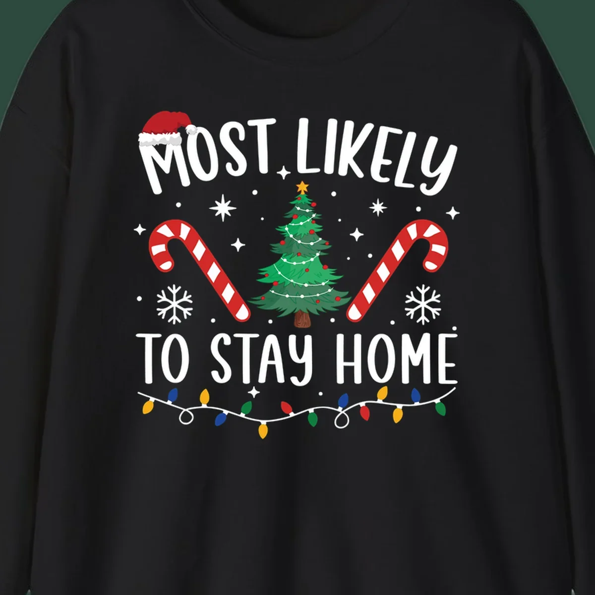 Most likely to stay home Christmas design with text, tree, candy canes, and lights.