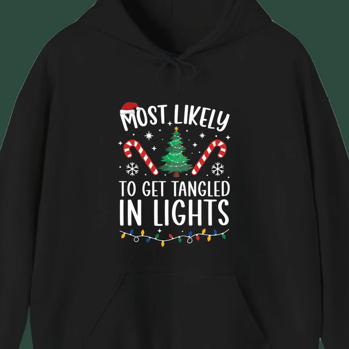 Most Likely To Get Tangled In Lights text with christmas tree, candy canes, and santa hat.