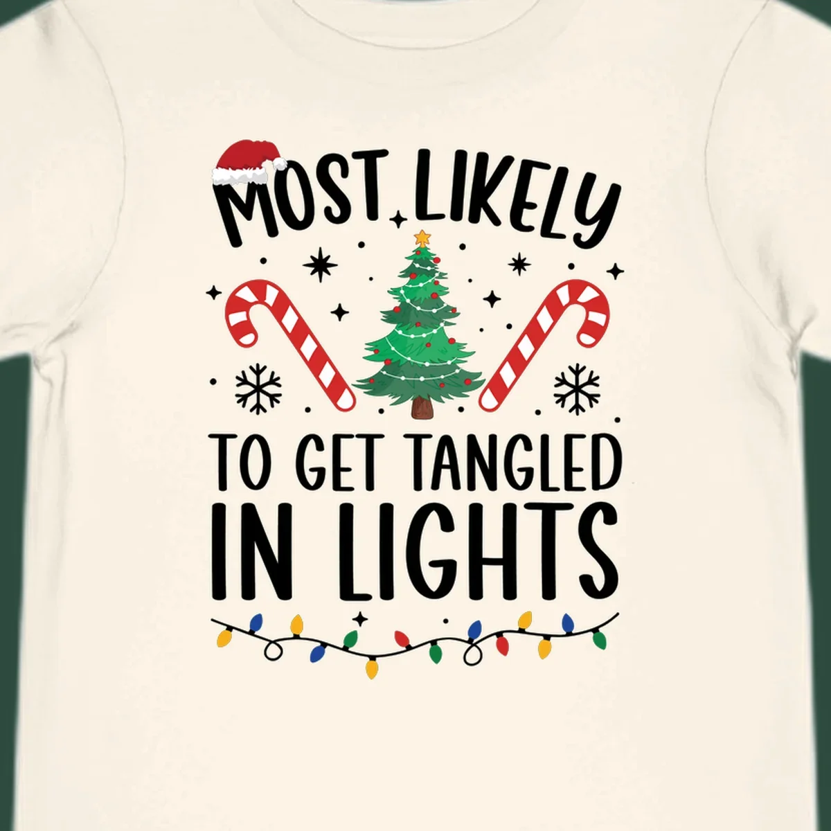 Most Likely To Get Tangled In Lights text with christmas tree, candy canes, and santa hat.