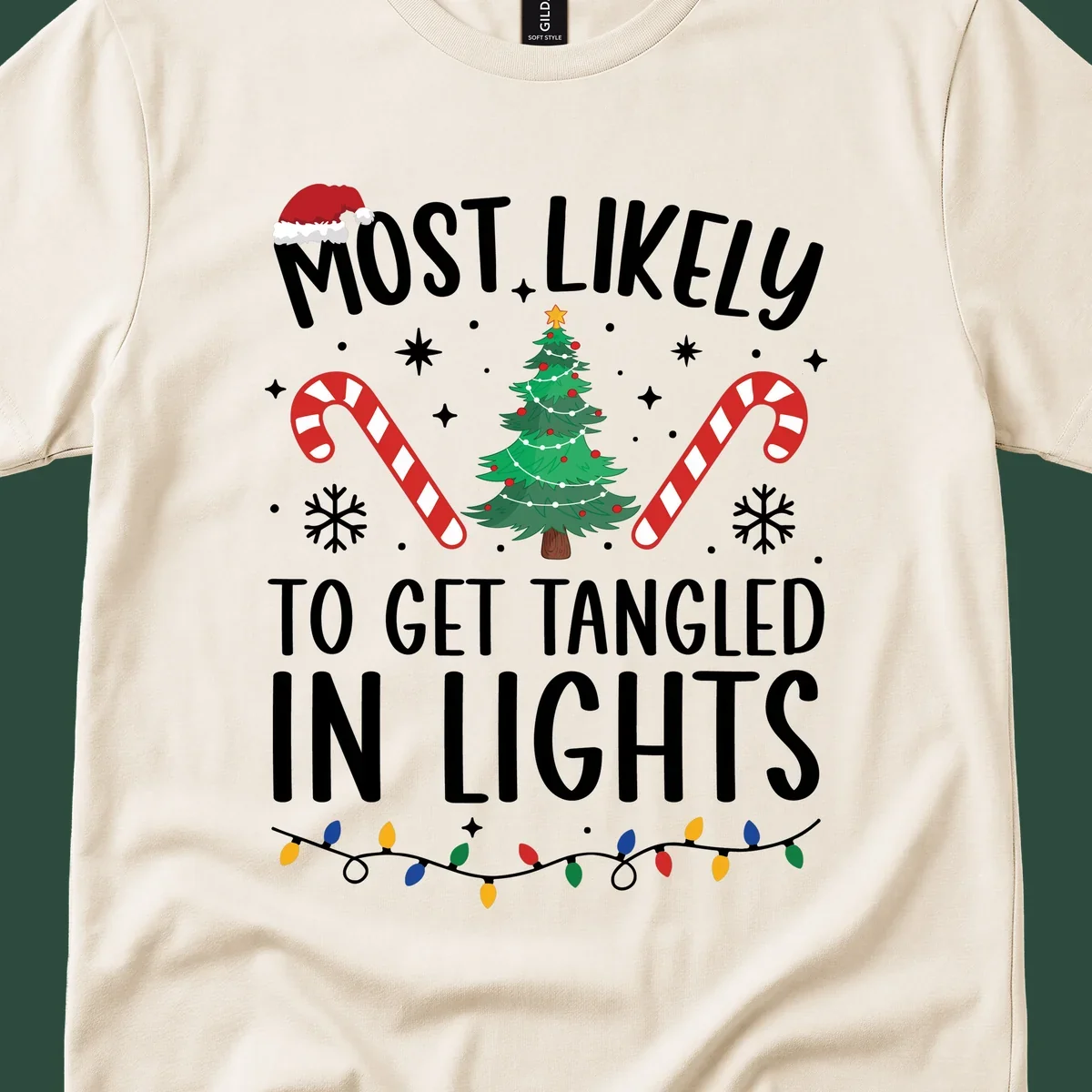 Most Likely To Get Tangled In Lights text with christmas tree, candy canes, and santa hat.