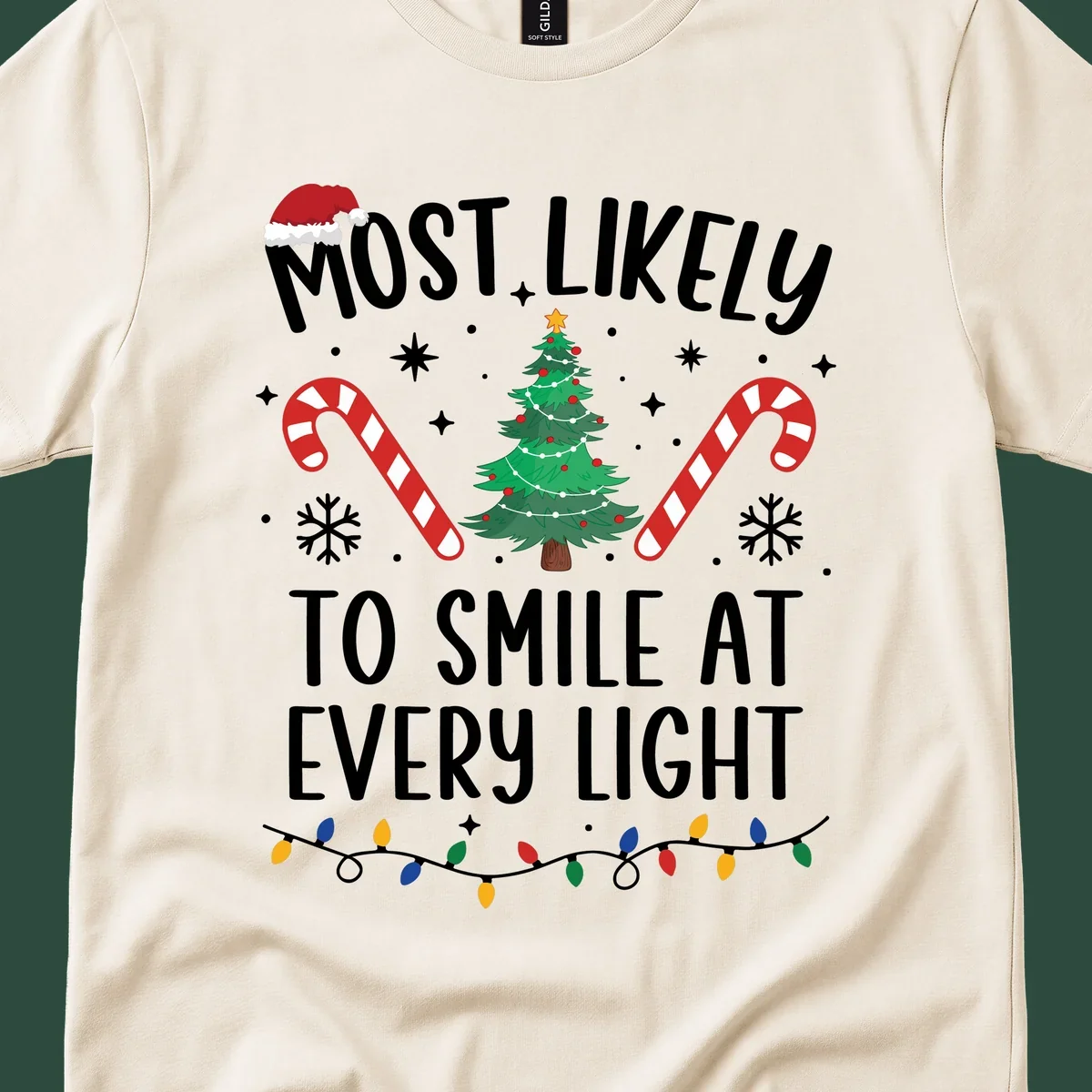 Most Likely To Smile At Every Light Christmas design with tree, candy canes, and lights.