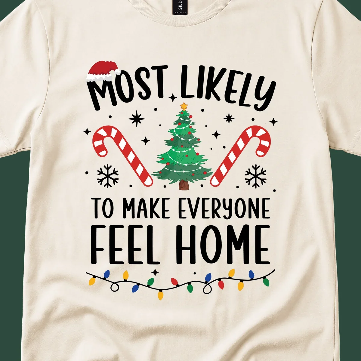 Most Likely To Make Everyone Feel Home Christmas design with Santa hat, tree, candy canes, and lights.