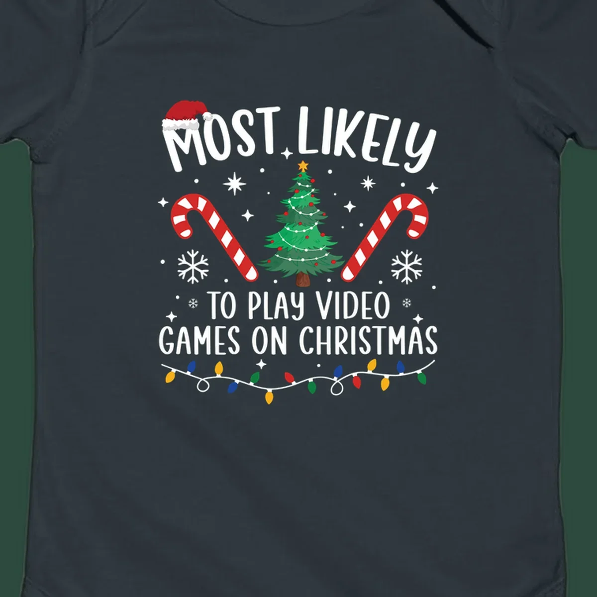 Most Likely To Play Video Games On Christmas design with text, Christmas tree, candy canes, and lights.