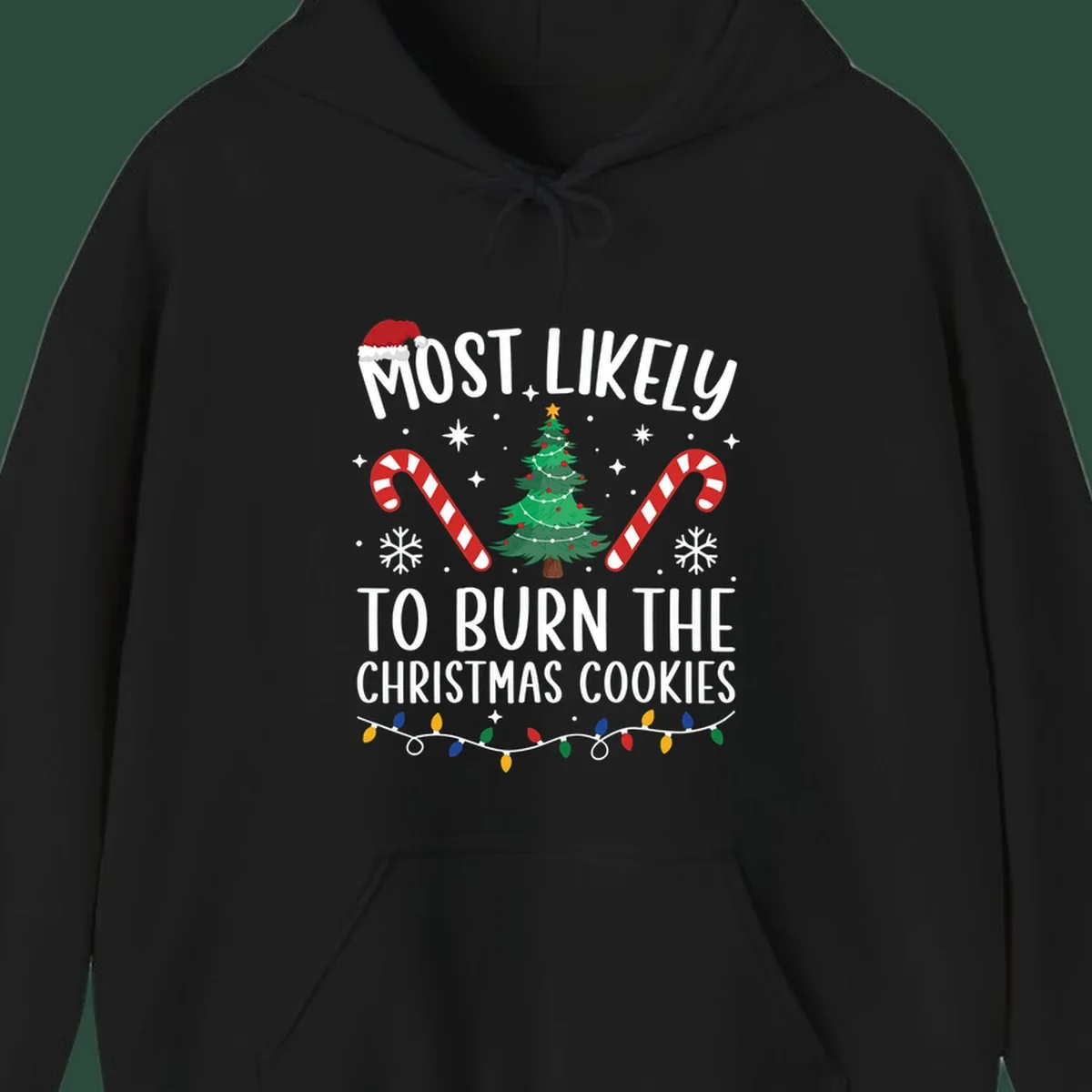 Most likely to burn Christmas Cookies text with Santa hat, Christmas tree, candy canes, snowflakes, stars, and lights. Christmas baking humor.