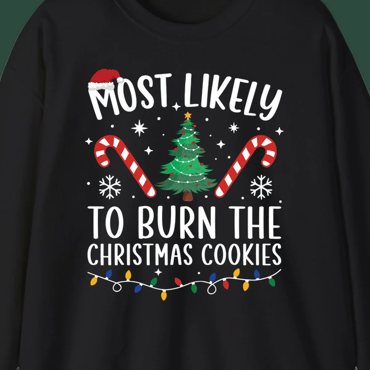 Most likely to burn Christmas Cookies text with Santa hat, Christmas tree, candy canes, snowflakes, stars, and lights. Christmas baking humor.