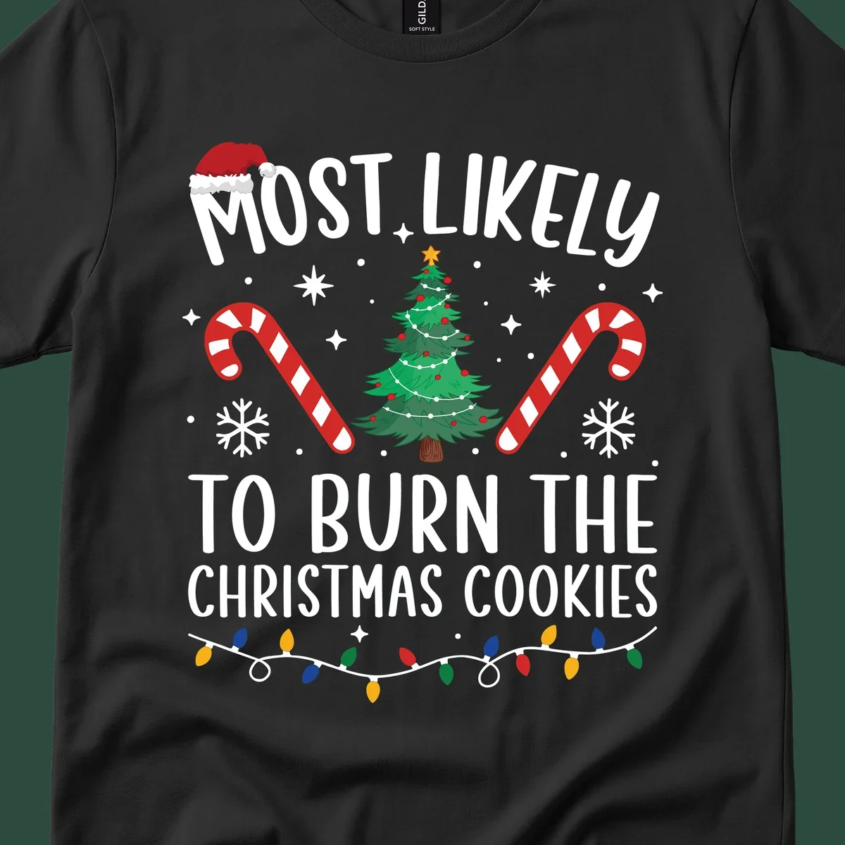 Most likely to burn Christmas Cookies text with Santa hat, Christmas tree, candy canes, snowflakes, stars, and lights. Christmas baking humor.
