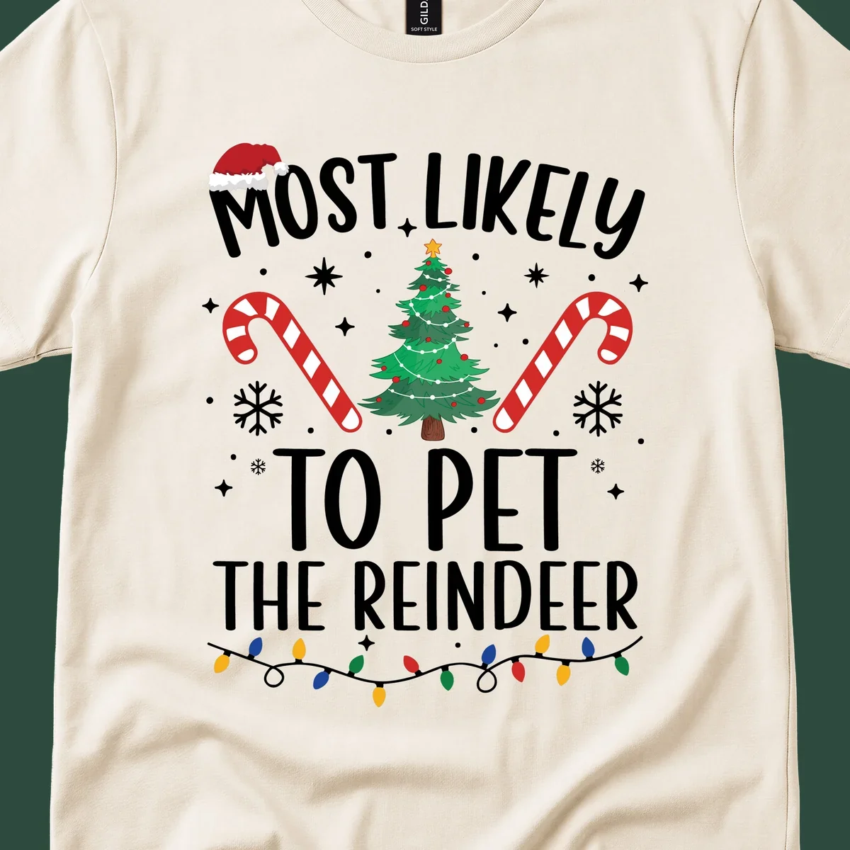 Most Likely To Pet The Reindeer Christmas design with text, Santa hat, tree, candy canes, and lights.