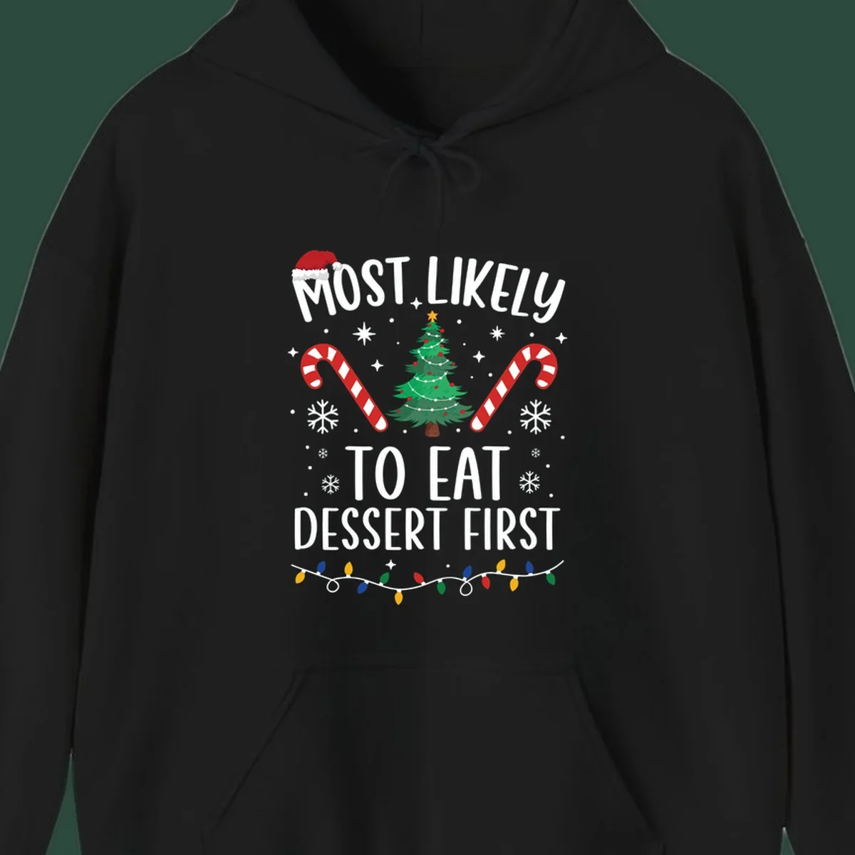 Most Likely To Eat Dessert First Christmas design with tree, candy canes, and Santa hat.
