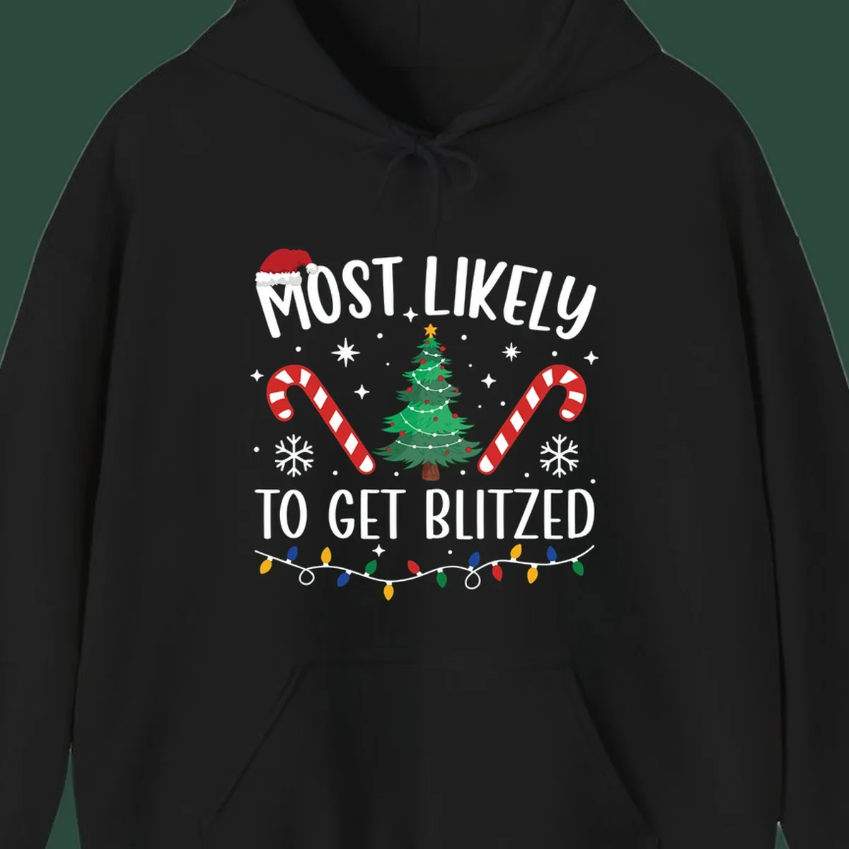 Most likely to get blitzed Christmas drinking text with tree, candy canes, and lights.
