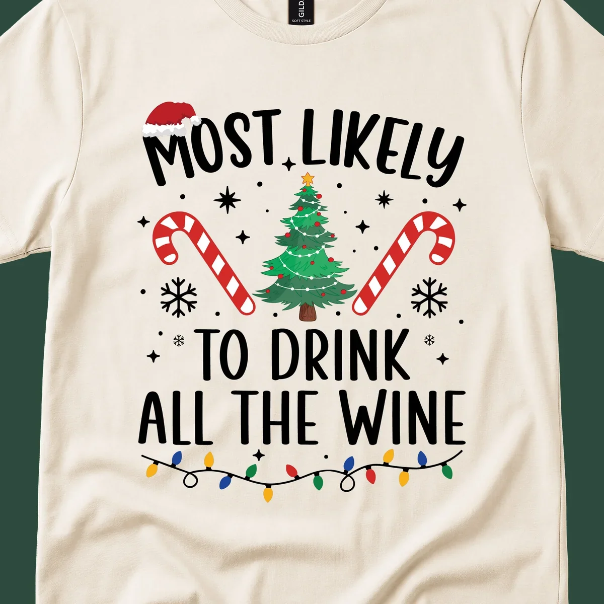 Most likely to drink all the wine Christmas design with text, tree, candy canes, and snowflakes.