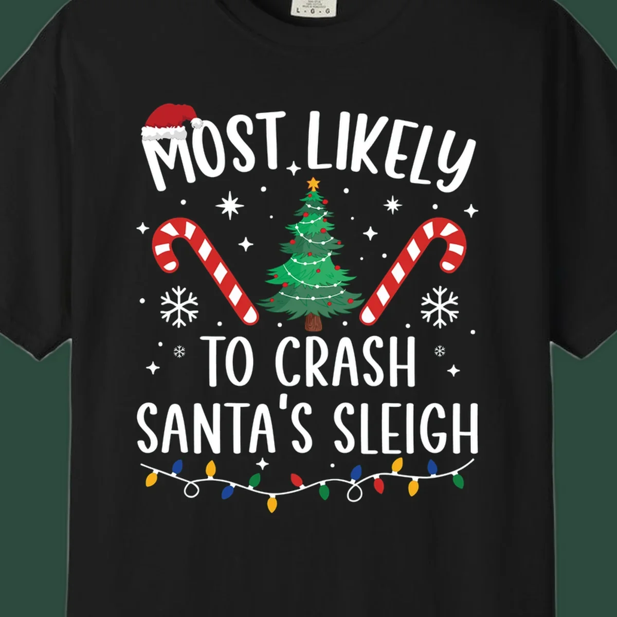 Most Likely To Crash Santa's Sleigh holiday design with Santa hat, Christmas tree, candy canes, and lights.