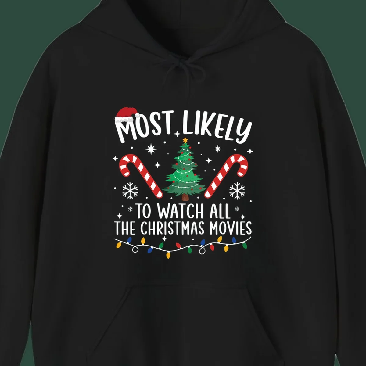 Most Likely To Watch All The Christmas Movies text with christmas tree, candy canes, and lights.