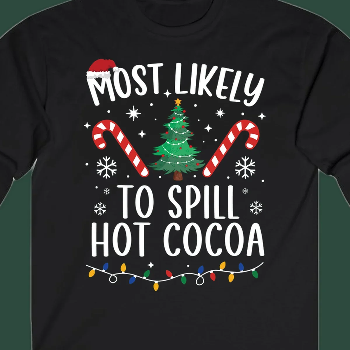 Most Likely To Spill Hot Cocoa Christmas design with text, tree, candy canes, and lights.