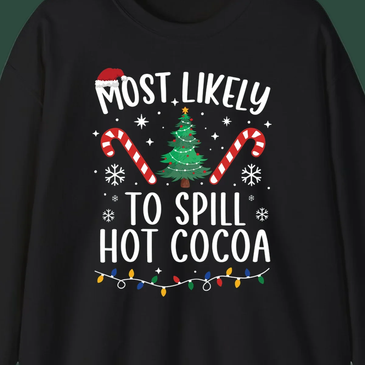 Most Likely To Spill Hot Cocoa Christmas design with text, tree, candy canes, and lights.