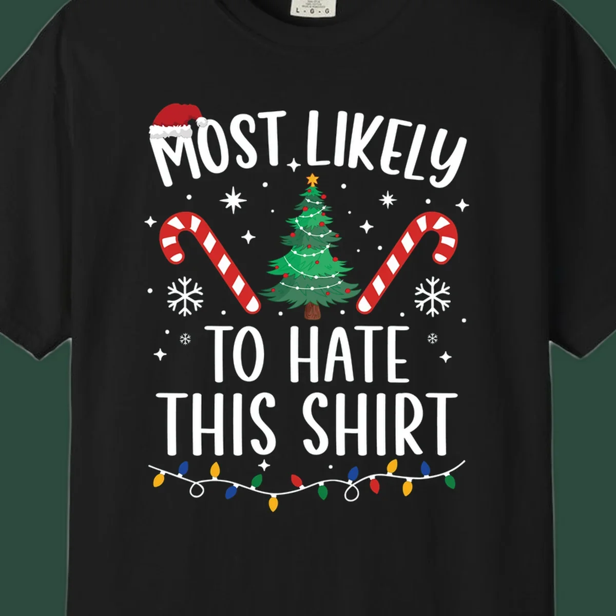 Text 'Most Likely To Hate This Shirt' with Christmas graphics like a tree, candy canes, and Santa hat.